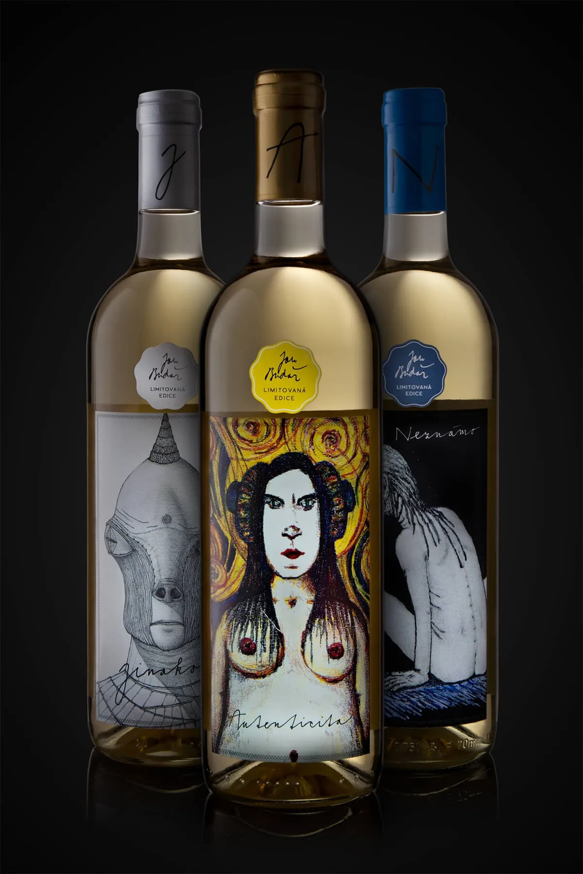 Three wine bottles with illustrations by Jan Budař