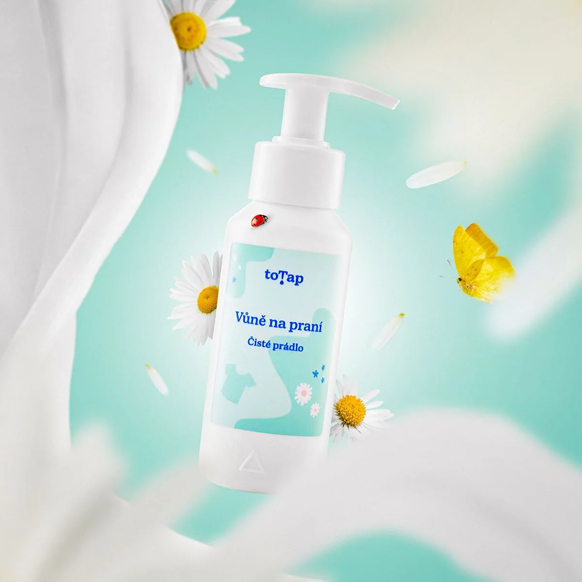 Creative photo of a levitating laundry perfume with daisies, a butterfly and a ladybird